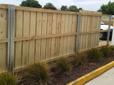 Steel channel post fix the wood fence.