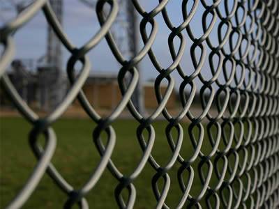 A galvanized chain link fence.