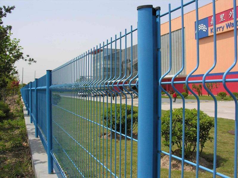 Blue color peach posts supporting blue color 3D security fence are installed as the security wall of factory.