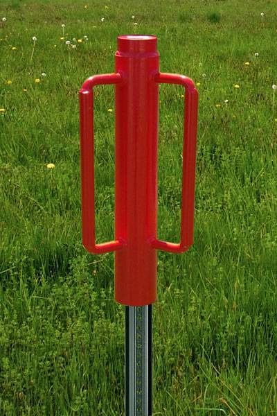 A red post driver is installing a U channel sign post on the grassland with a detail of U channel sign post.
