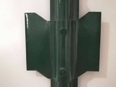 A plate is installed on the Green color U post.